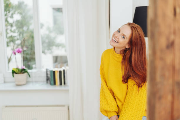 istock Relaxed happy young redhead woman indoors 1073554494