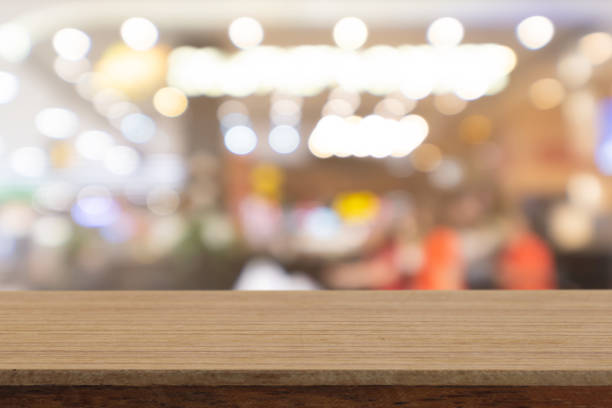 istock Perspective empty white wooden table on top over blur background, can be used mock up for montage products display or design layout. 1073555182