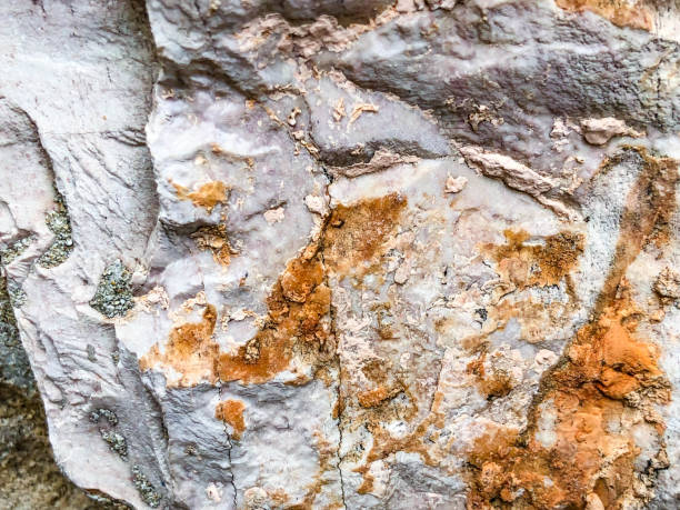 istock Close up of natural stone wall. Stone wall texture 1073555796