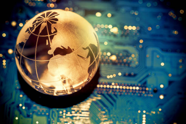 istock World transparent globe earth on computer motherboard. Global communications business concept. Toned 1073559074