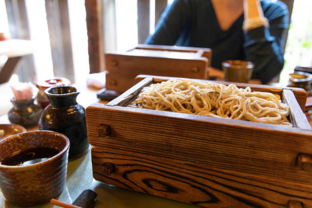 Eating soba noodle with friend at a restaurant