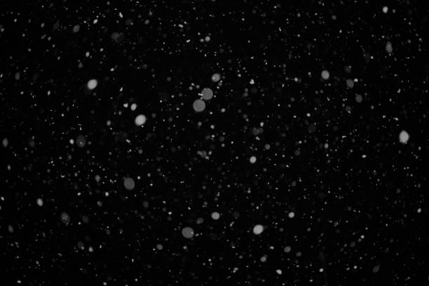 istock a snow  on the black backgrounds 1073575872