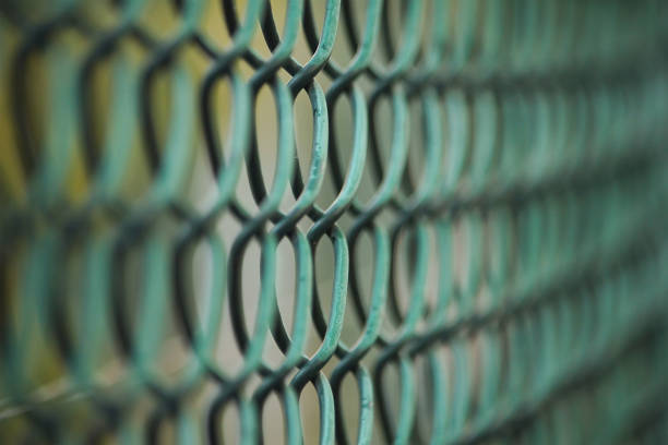 istock Iron wire fence metal texture close up 1073577540