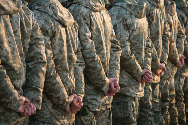 istock Army parade, military uniform soldier row march 1073577588