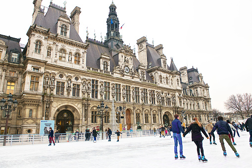 People ice skating in front of the Hôtel de Ville.this building housing the local administration, the Mayor of Paris (since 1977), and also serves as a venue for large receptions.