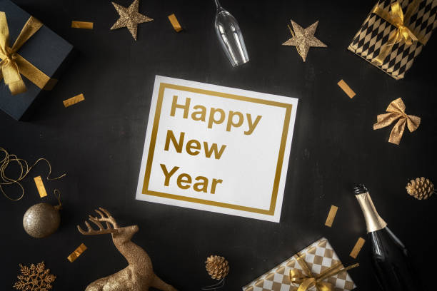 istock Baubles and gifts on black desk 1073588736