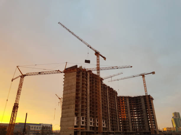 istock Tower cranes but against backdrop of construction 1073590146