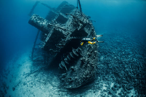 istock Scuba diver exploring a shipwreck underwater in the Red Sea 1073592804