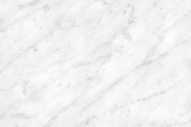 istock White Carrara Marble natural light surface for bathroom or kitchen countertop 1073593726
