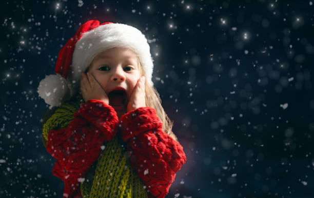 istock girl on snowy background 1073593782