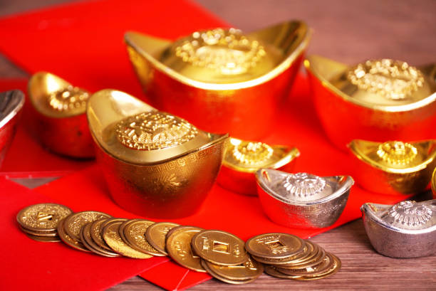 istock Gold bar and silver with red envelope decorate for chinese new year theme 1073597610
