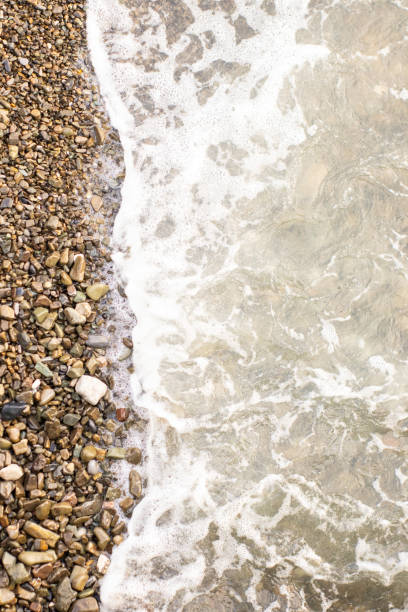 istock Beach stone background with sea 1073598912