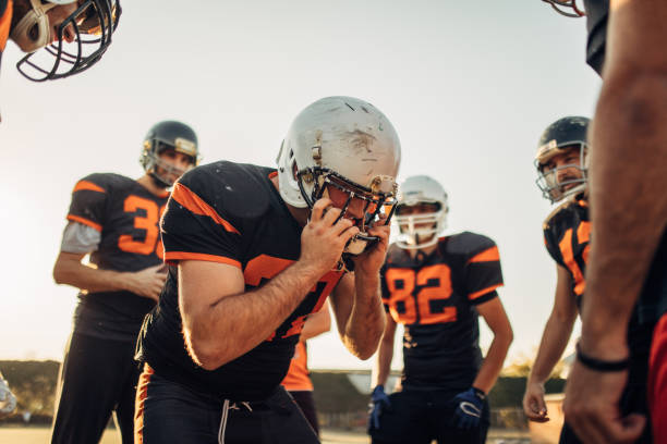 istock American football players practice 1073607372