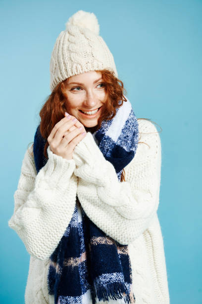 istock Young woman applying hand cream and looking at copy space 1073613266