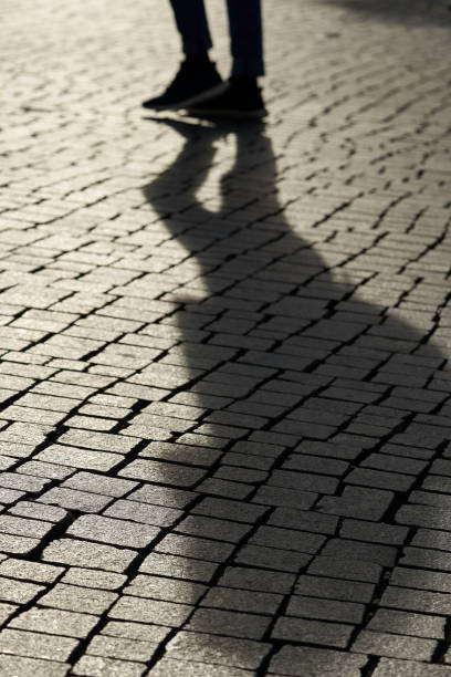 istock Shadow of a pedestrian 1073621296