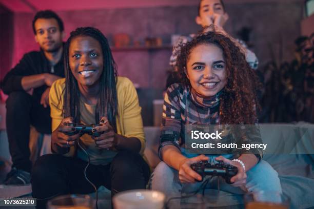 Friends Love Video Games Stock Photo - Download Image Now - Video Game, Gamer, Playing