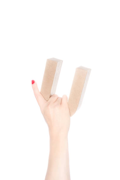 istock She holds up a cardboard  letter U 1073625436