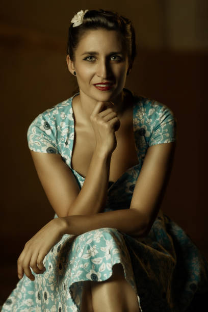 istock Spanish woman dressed in blue smiling at camera. 1073638214