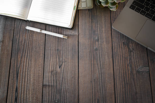 istock Office wooden workspace with office supplies and copy space 1073649890