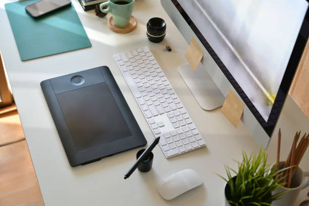 istock Top view artist designer workspace, computer, digital drawing tablet and creative supplies 1073651346