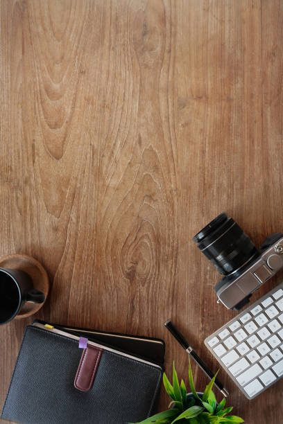 istock Wood table workspace of hipster minimal with gadget and copy space 1073654008