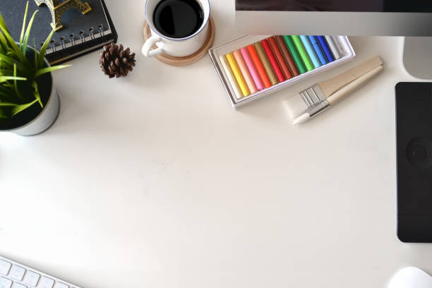 istock Top view artist workspace, creative supplies and copy space 1073655688