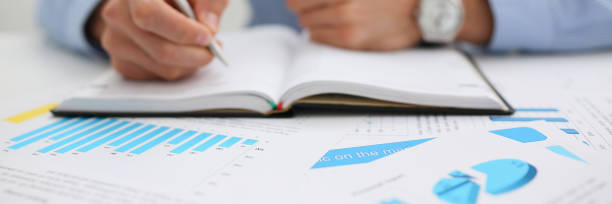 istock Businessman holding pan in hand financial statistics 1073656218