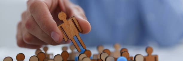 istock A businessman in blue shirt is holding a magnifying 1073656276