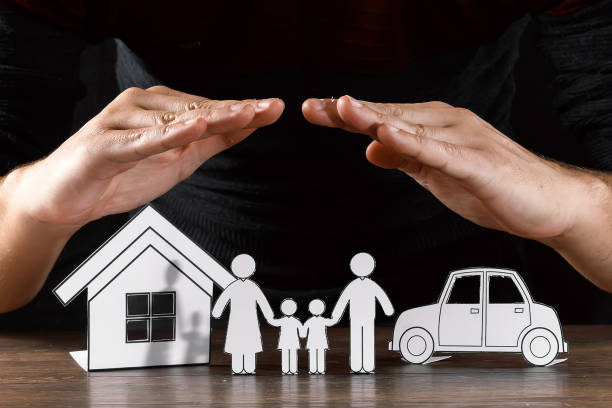 istock insurance house protection concepts, Hands post protect over house. 1073657148