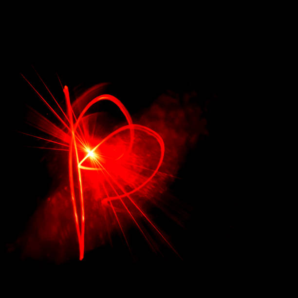 istock Abstract red light. Wandering red light in the dark. Black background with red abstract lines. 1073658376
