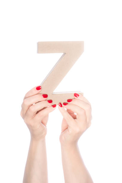 istock She holds up a cardboard  letter Z 1073661014