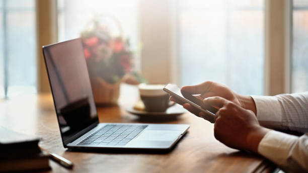 istock Cropped shot of man hand using mobile smart phone in office workplace 1073661770