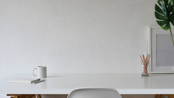 istock Workspace and copy space, White desk and mockup poster 1073662082