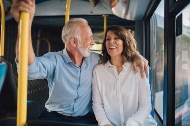 istock Senior couple hugging in a bus 1073662522
