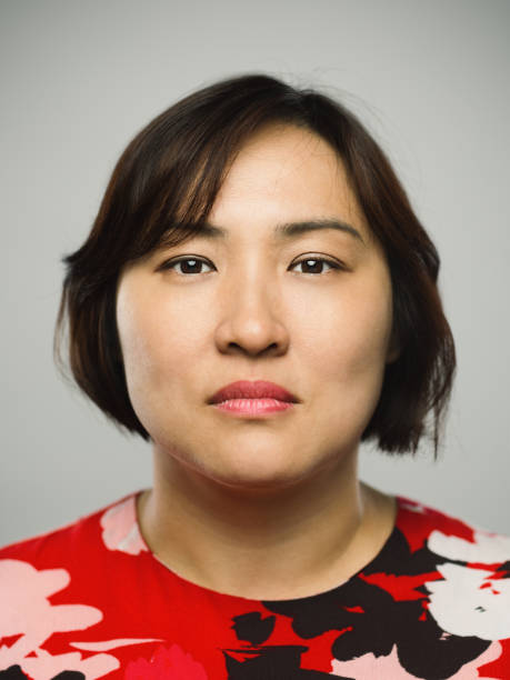 istock Real chinese mature woman with blank expression 1073670652