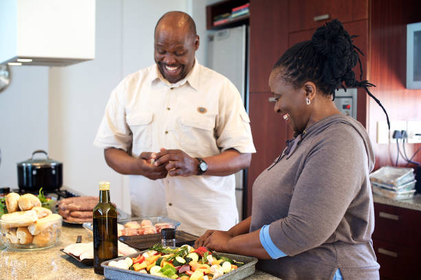 istock Senior couple preparing food in the kitchen 1073670936