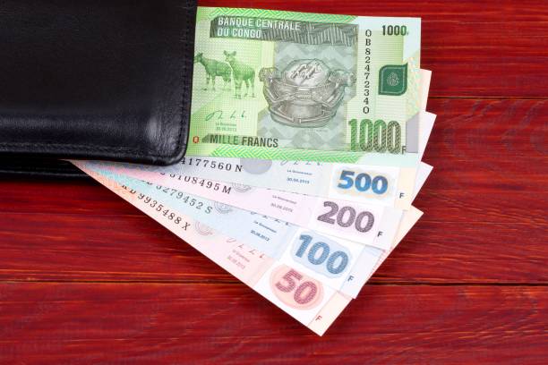 istock Congolese money in the black wallet 1073671352