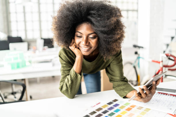 istock Afro woman on her workplace 1073673042