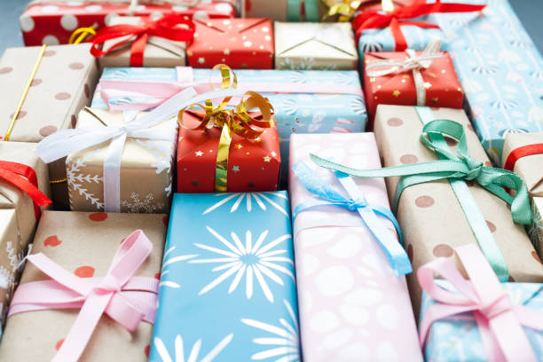 istock Different christmas gifts on a black background 1073674890
