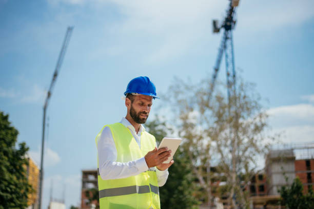istock Young male engineer with digital tablet 1073675056