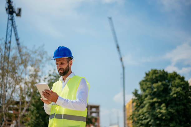 istock Young male engineer with digital tablet 1073675078