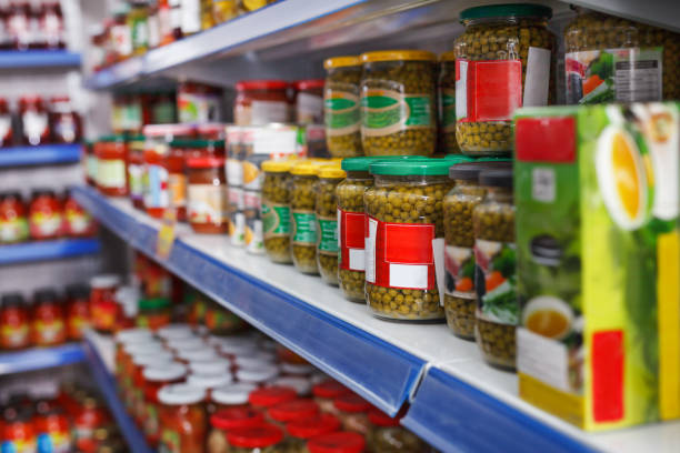 istock Different pickle goods at shelves in food store 1073677346
