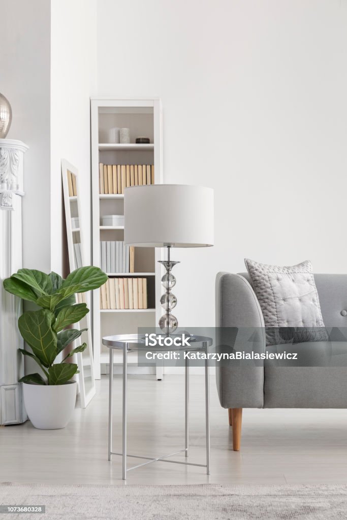 volgens Geliefde analoog Elegant White Lamp On Small Silver Table Next To Grey Sofa In Spacious New  Yorks Style Living Room Stock Photo - Download Image Now - iStock