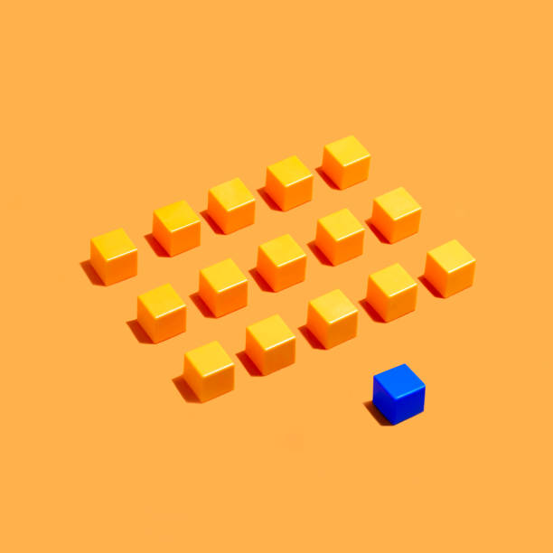 istock Leadership concept: rows of yellow cubes and blue in front 1073682842
