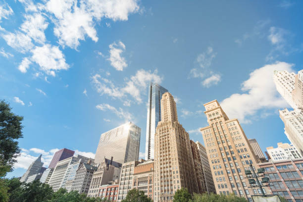 istock Low angle view of Chicago skyscrapers under cloud blue sky 1073687378