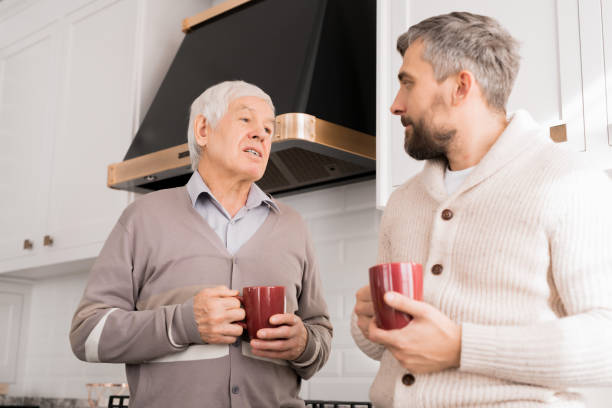 istock Senior Father Talking to Adult Son 1073687964