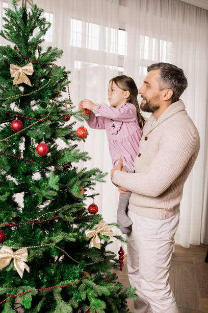 istock Father and Child Preparing for Christmas 1073688020