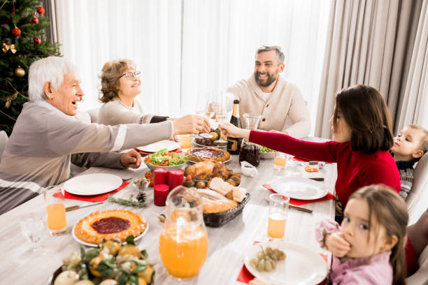 istock Family Enjoying Christmas Feast 1073688076