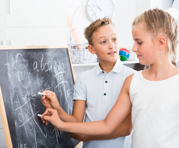 istock Brother with sister are doing homework on desk 1073692520