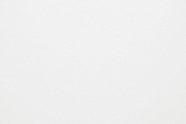 istock White cement concrete wall texture for background and design art work. 1073697254